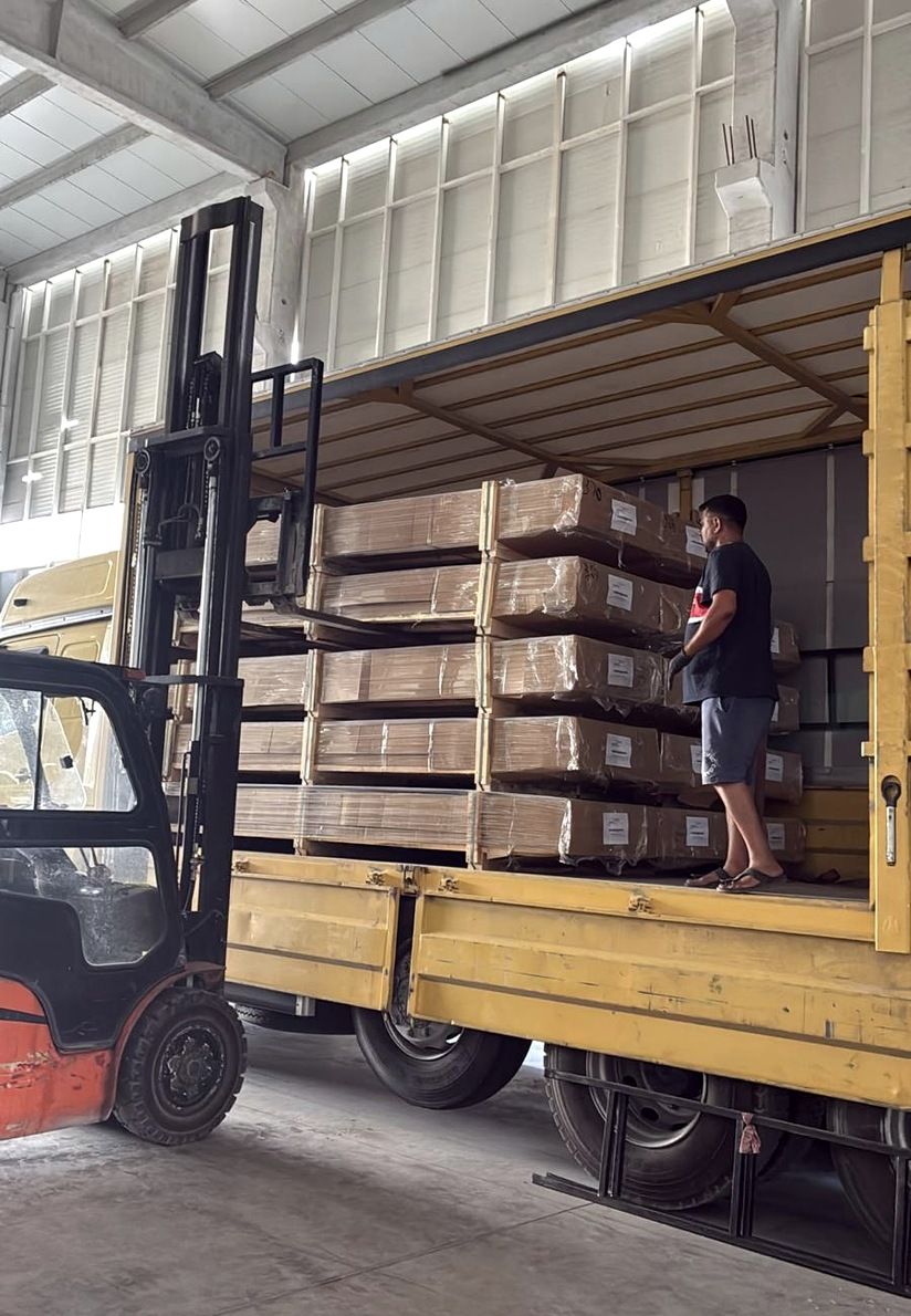 Packed profile crates being loaded by forklift